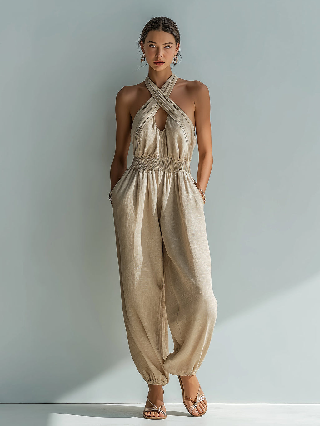 Chic Elegant Beige Linen Cross Halter-Neck Sleeveless Cutout Detail Elastic-Waist Loose-Fit Cuffed Jumpsuit