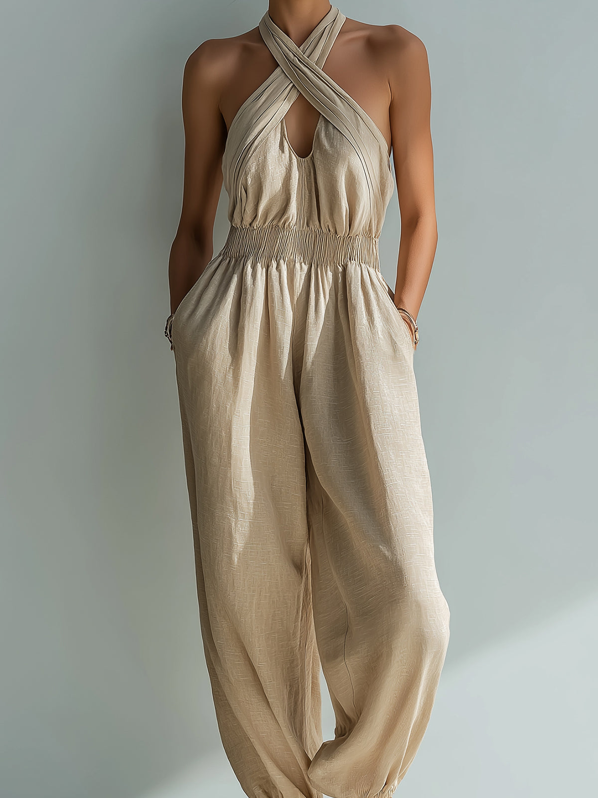 Chic Elegant Beige Linen Cross Halter-Neck Sleeveless Cutout Detail Elastic-Waist Loose-Fit Cuffed Jumpsuit
