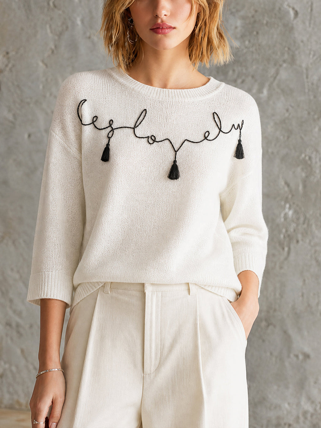 Chic Off-White Round Neck Black Handwritten Letter Embroidery Tassel Detail Three-Quarter Sleeve Loose-Fit Knit Sweater Top