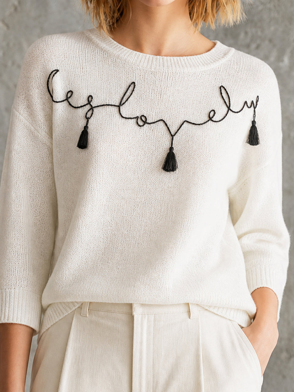 Chic Off-White Round Neck Black Handwritten Letter Embroidery Tassel Detail Three-Quarter Sleeve Loose-Fit Knit Sweater Top